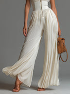 Nova | Witte Jumpsuit met V-hals en Wijde Pijpen